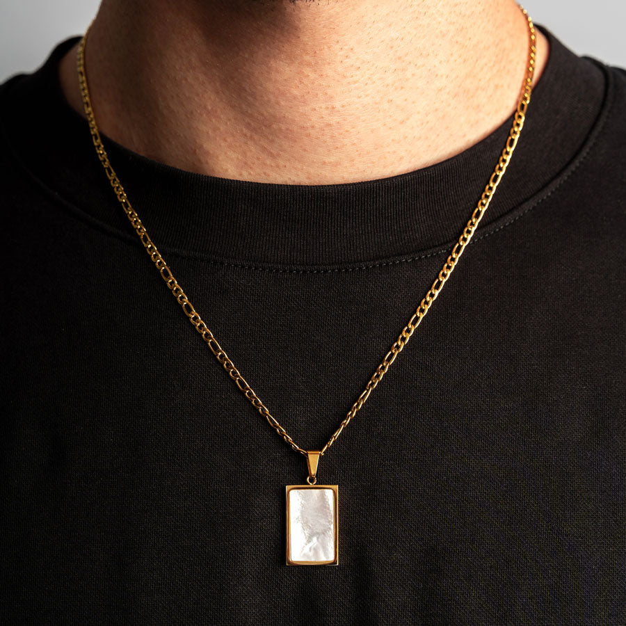 Our Premium Rectangle Pendant paired with our Signature Figaro Chain is the perfect touch of Gold & White.